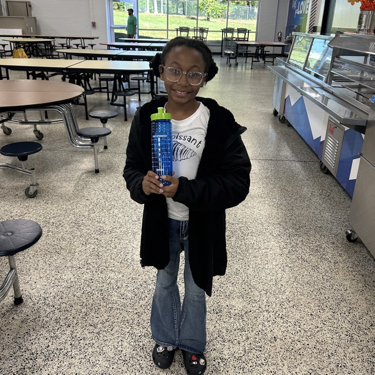 “Students and staff celebrating National School Lunch Week in the cafeteria.”