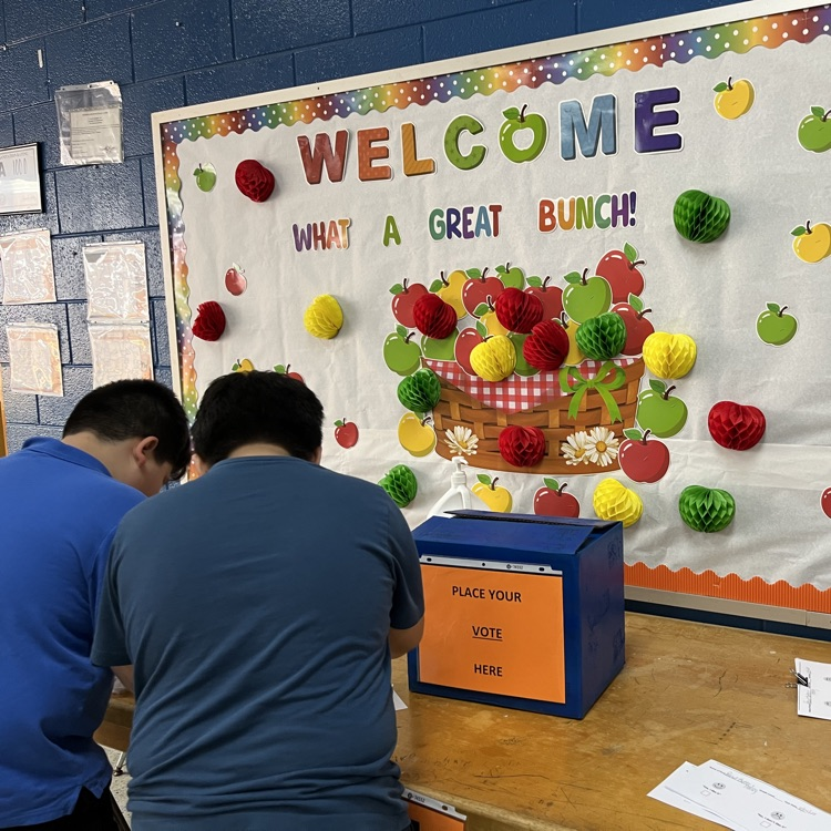 “Students and staff celebrating National School Lunch Week in the cafeteria.”