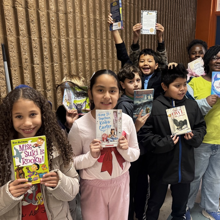 Elementary students at Lexington City Schools receive books during a schoolwide distribution made possible through partnerships with Communities In Schools and the Rotary Club of Lexington.