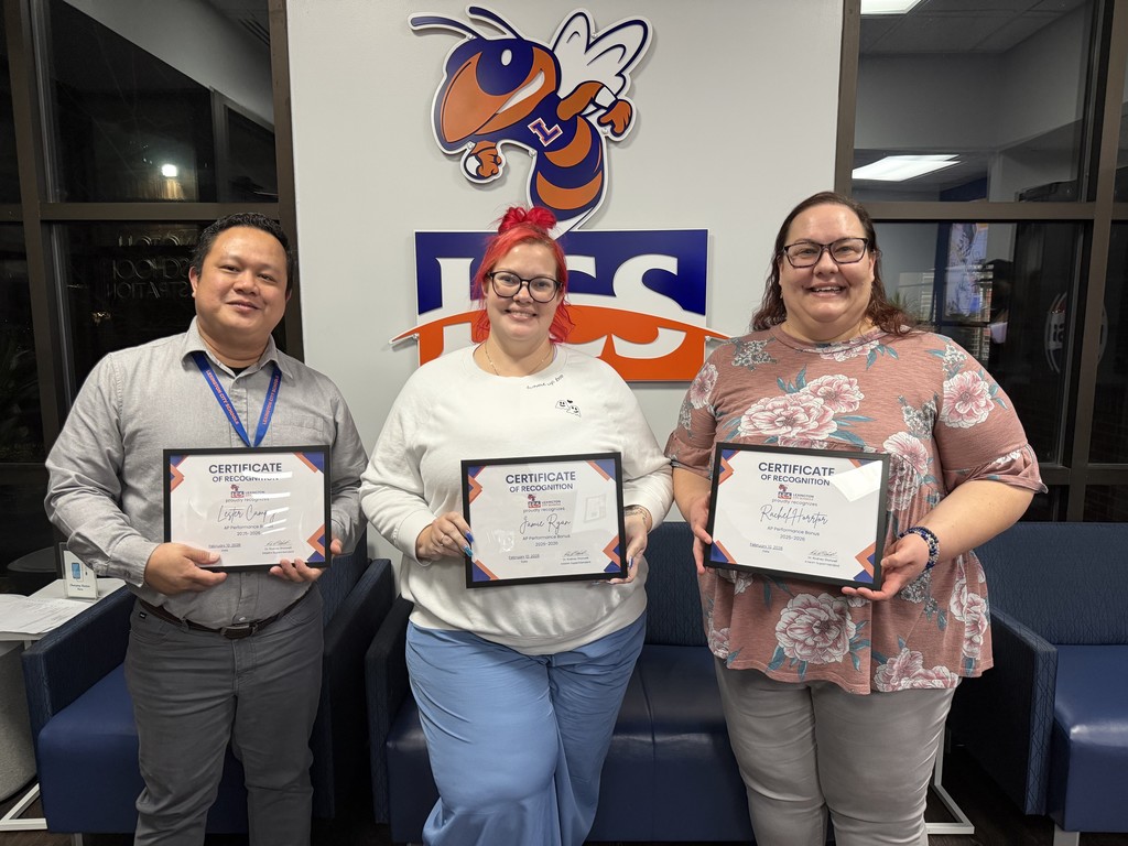 Group photo taken during the Board of Education meeting recognizing Advanced Placement (AP) teachers for earning state performance bonuses based on 2024–2025 AP testing results.