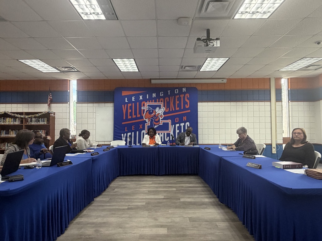 Photos from the April 21, 2026 Board meeting appointing Dr. Ron Anthony as Superintendent of Lexington City Schools, including Dr. Anthony, Board members, his family, and attendees.