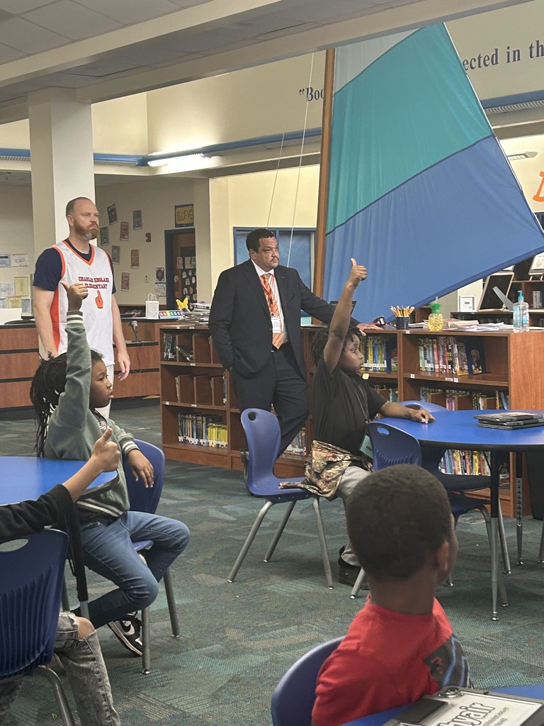 Dr. Ron Anthony visiting multiple schools across the district on his first day, interacting with students and staff in classrooms and hallways.