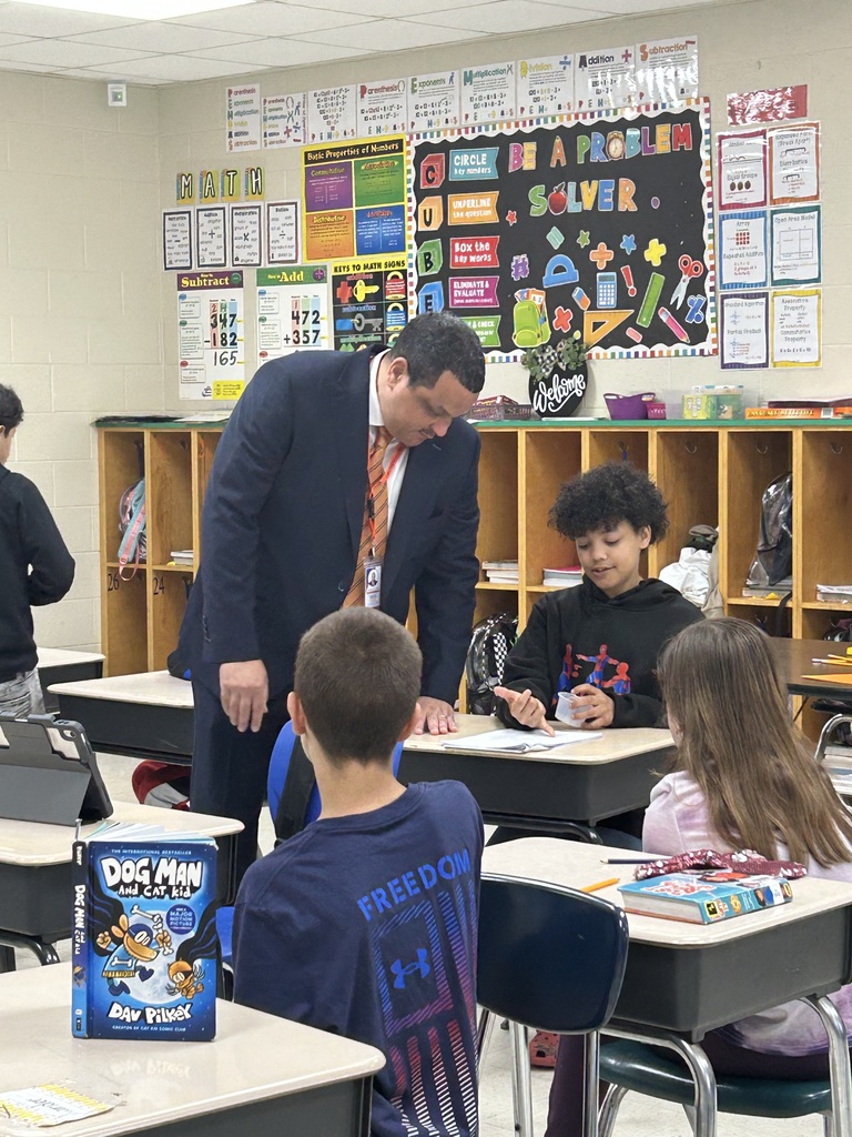 Dr. Ron Anthony visiting multiple schools across the district on his first day, interacting with students and staff in classrooms and hallways.