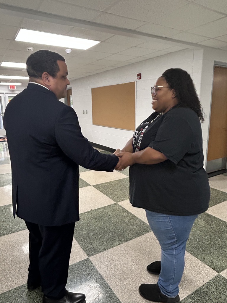 Dr. Ron Anthony visiting multiple schools across the district on his first day, interacting with students and staff in classrooms and hallways.