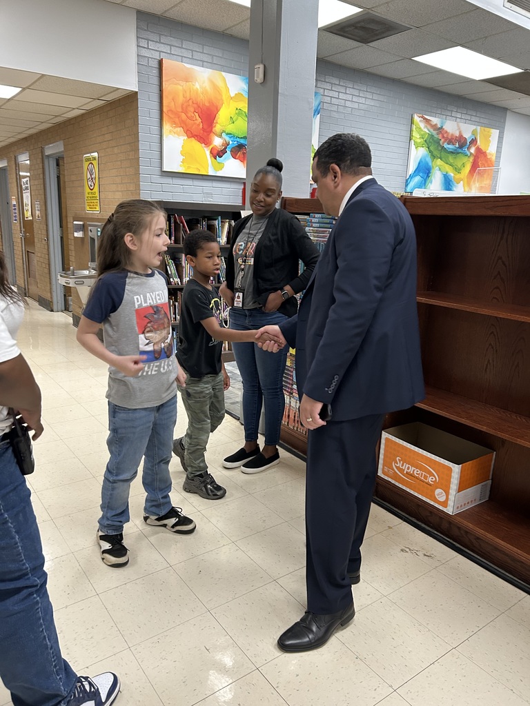Dr. Ron Anthony visiting multiple schools across the district on his first day, interacting with students and staff in classrooms and hallways.