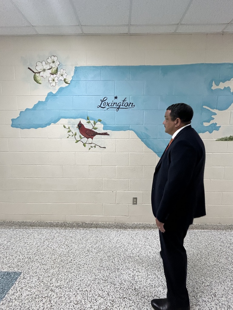 Dr. Ron Anthony visiting multiple schools across the district on his first day, interacting with students and staff in classrooms and hallways.