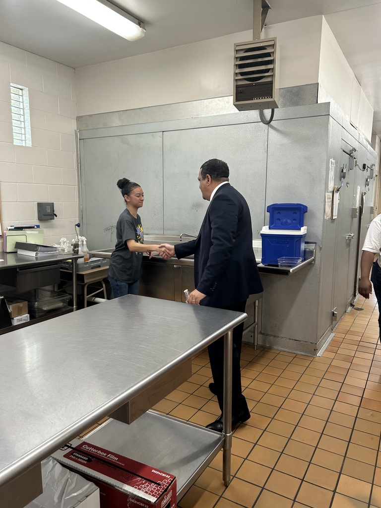 Dr. Ron Anthony visiting multiple schools across the district on his first day, interacting with students and staff in classrooms and hallways.