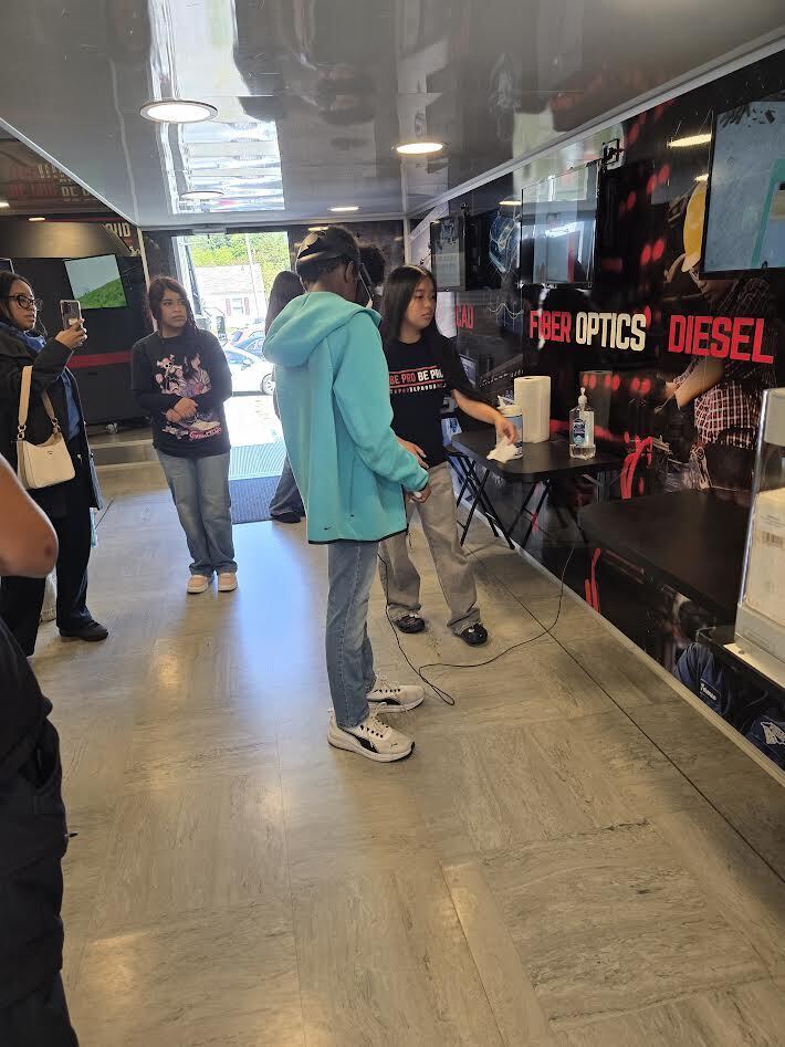 Students explore hands on career simulations and skilled trades experiences during the Be Pro Be Proud Mobile Workshop at Lexington Senior High School.