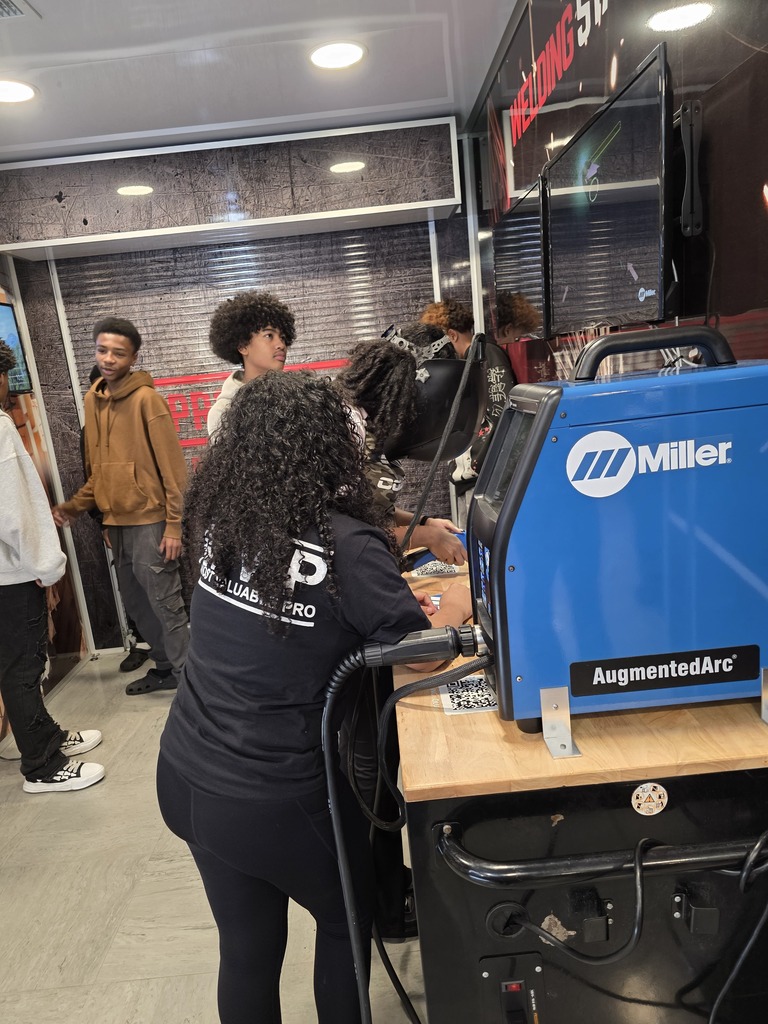 Students explore hands on career simulations and skilled trades experiences during the Be Pro Be Proud Mobile Workshop at Lexington Senior High School.