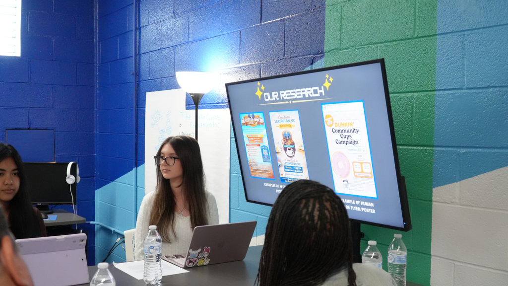 Students present their research and recommendations to community and business leaders during a SparkLabNC project, sharing innovative solutions to address workforce challenges and strengthen future career pathways in Lexington.