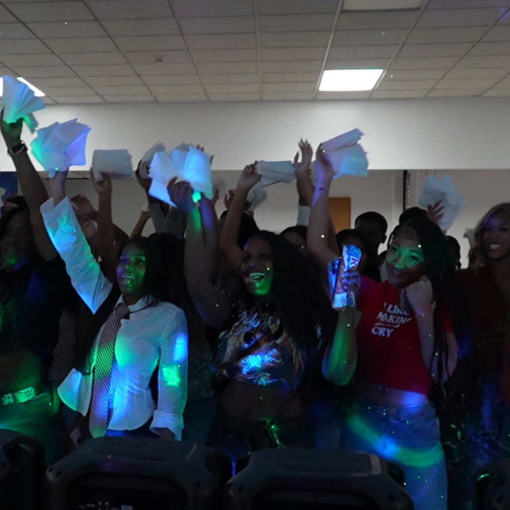 LSHS students pose while holding up two and seven with their fingers to represent the Class of 2027.