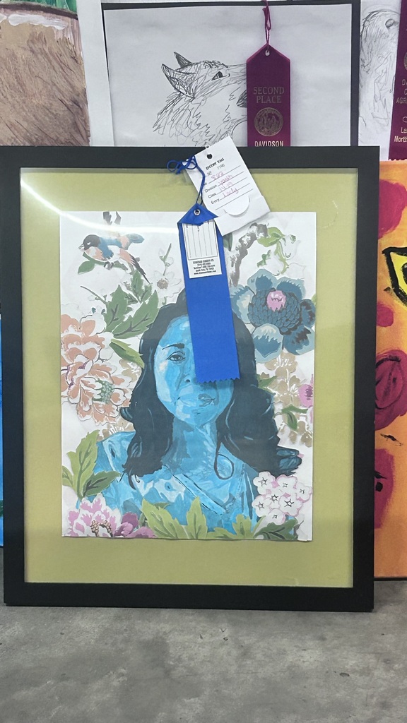 Several LSHS students and their artwork. These students won 1st place at the fair with their work. 