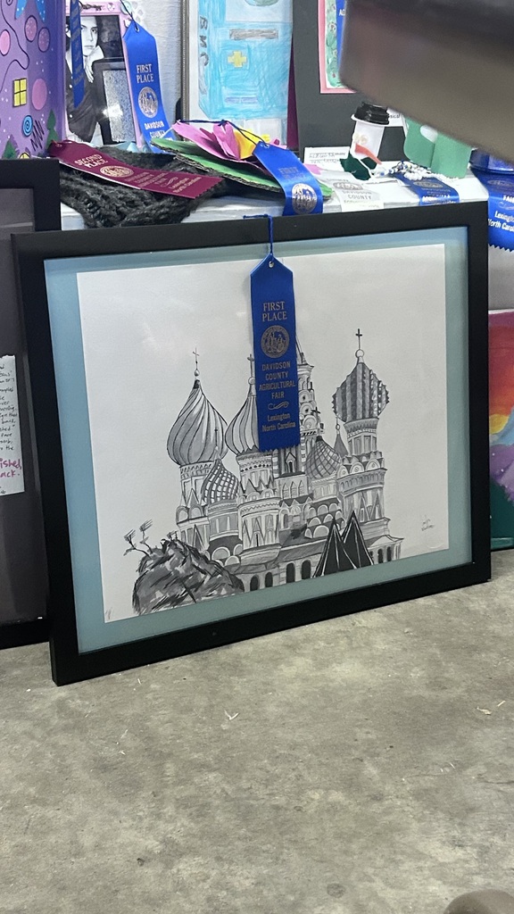Several LSHS students and their artwork. These students won 1st place at the fair with their work. 