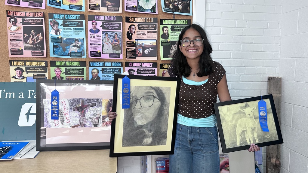 Several LSHS students and their artwork. These students won 1st place at the fair with their work. 