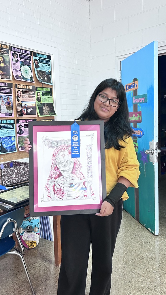Several LSHS students and their artwork. These students won 1st place at the fair with their work. 