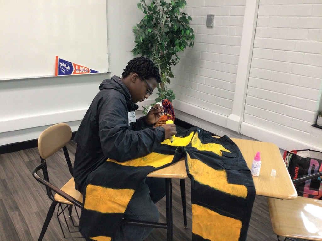 Ahmad Williamson and Julian Stockton work on fashion designs and showcase their completed pieces at Winston Salem Fashion Week.