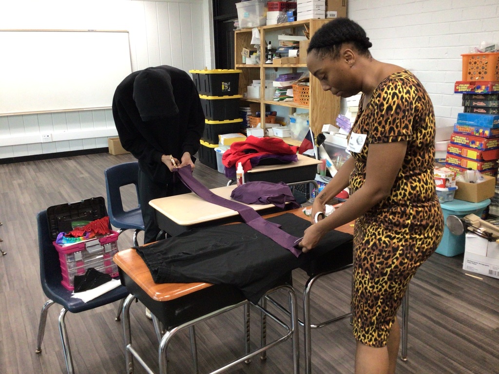 Ahmad Williamson and Julian Stockton work on fashion designs and showcase their completed pieces at Winston Salem Fashion Week.