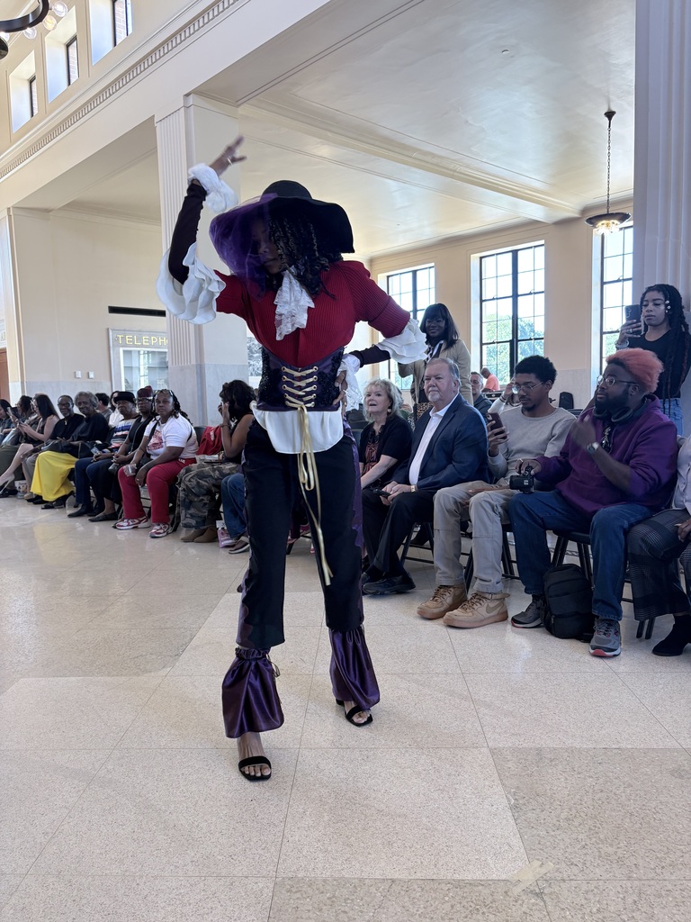 Ahmad Williamson and Julian Stockton work on fashion designs and showcase their completed pieces at Winston Salem Fashion Week.
