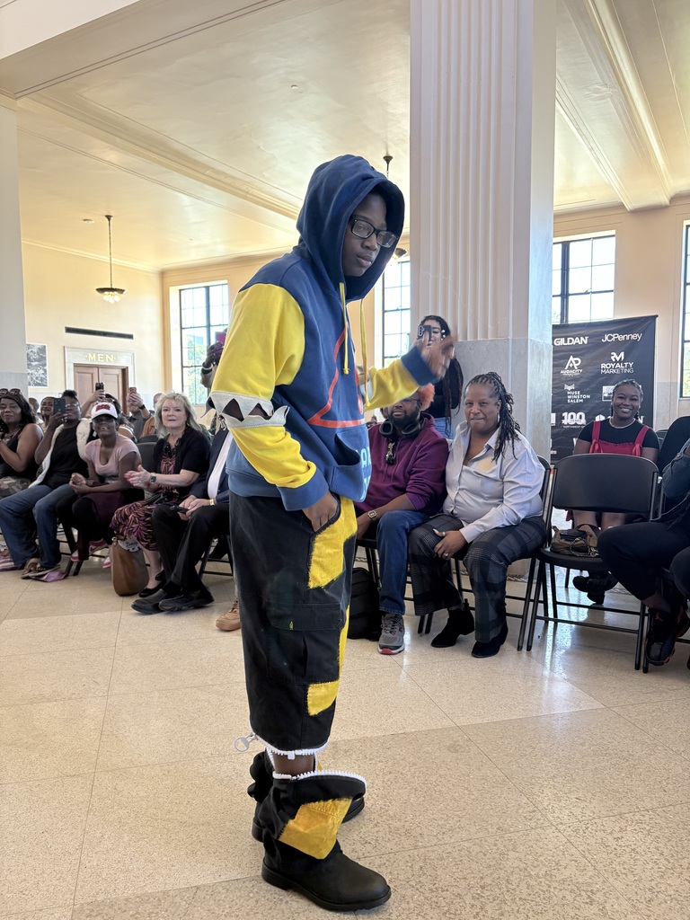 Ahmad Williamson and Julian Stockton work on fashion designs and showcase their completed pieces at Winston Salem Fashion Week.