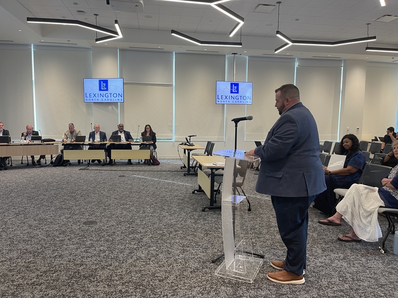 Executive Director of Human Resources Dr. Bruce Carroll addresses the Lexington City Council on August 25, 2025, sharing staff survey results, recruitment challenges, and the importance of supporting classified employees.