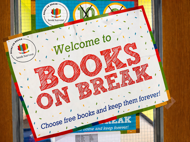 Students select and take home books during the Books on Break event, expanding access to literacy beyond the classroom.