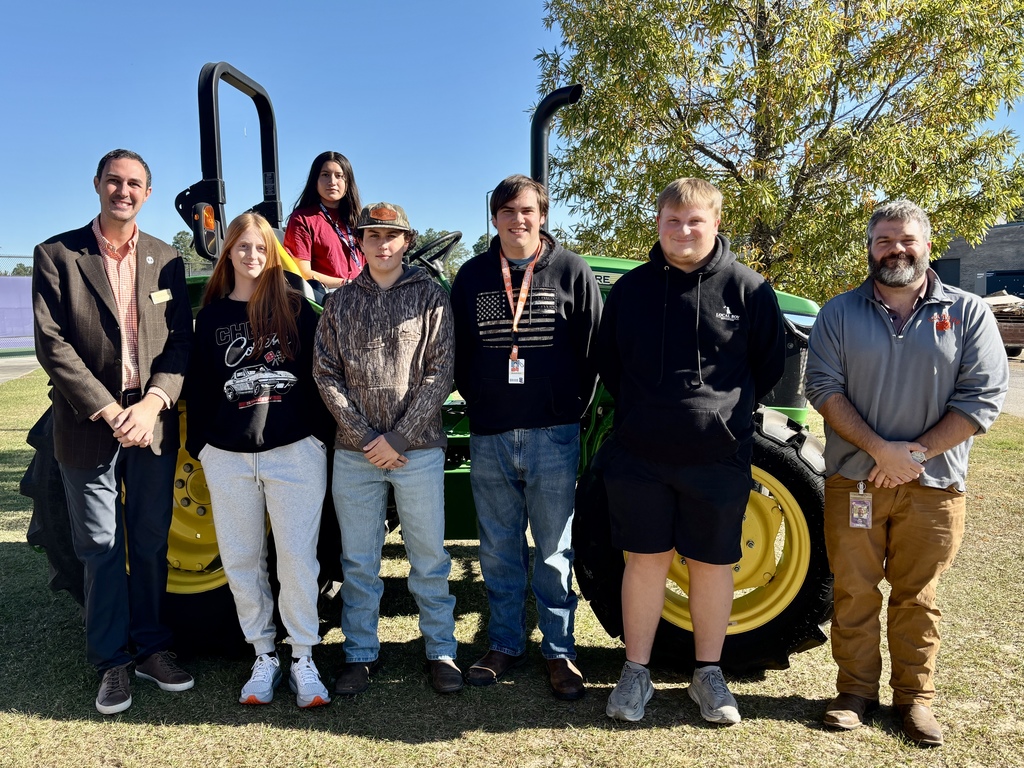 SC Teacher of the Year visits ag class at BLHS. He's pictured with students here in front of our new tractor.