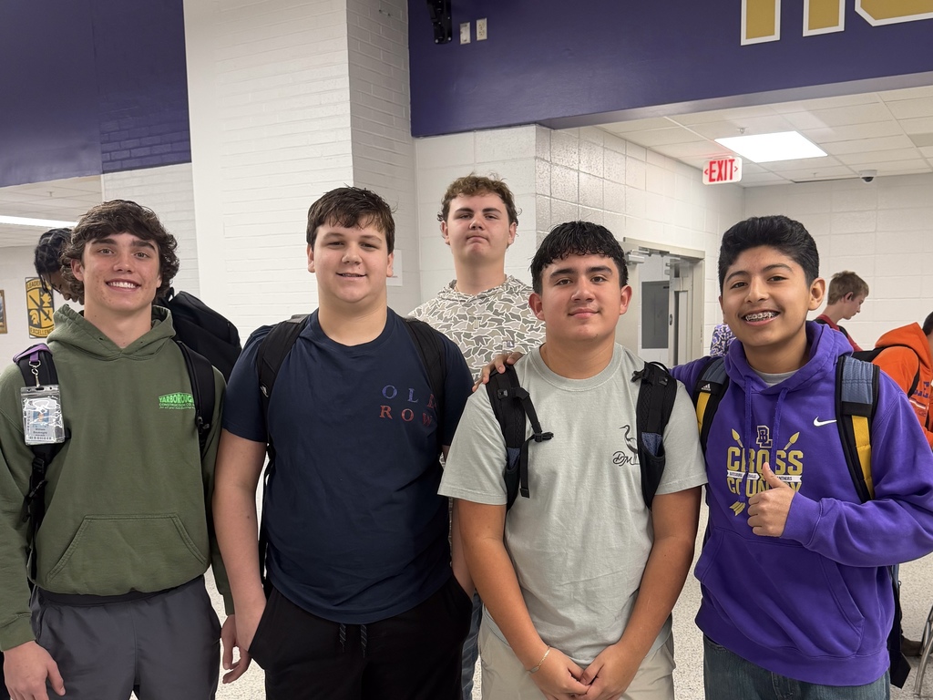 Students smiling after winter break