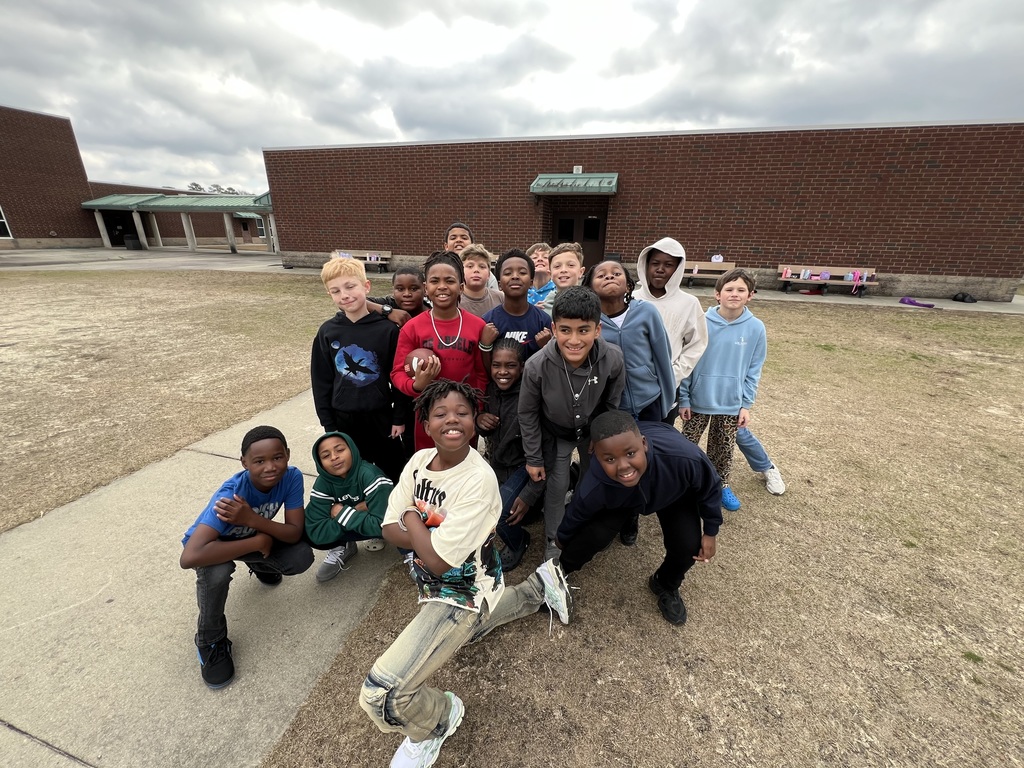 Students smiling after winter break