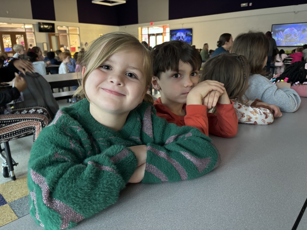 Students smiling after winter break