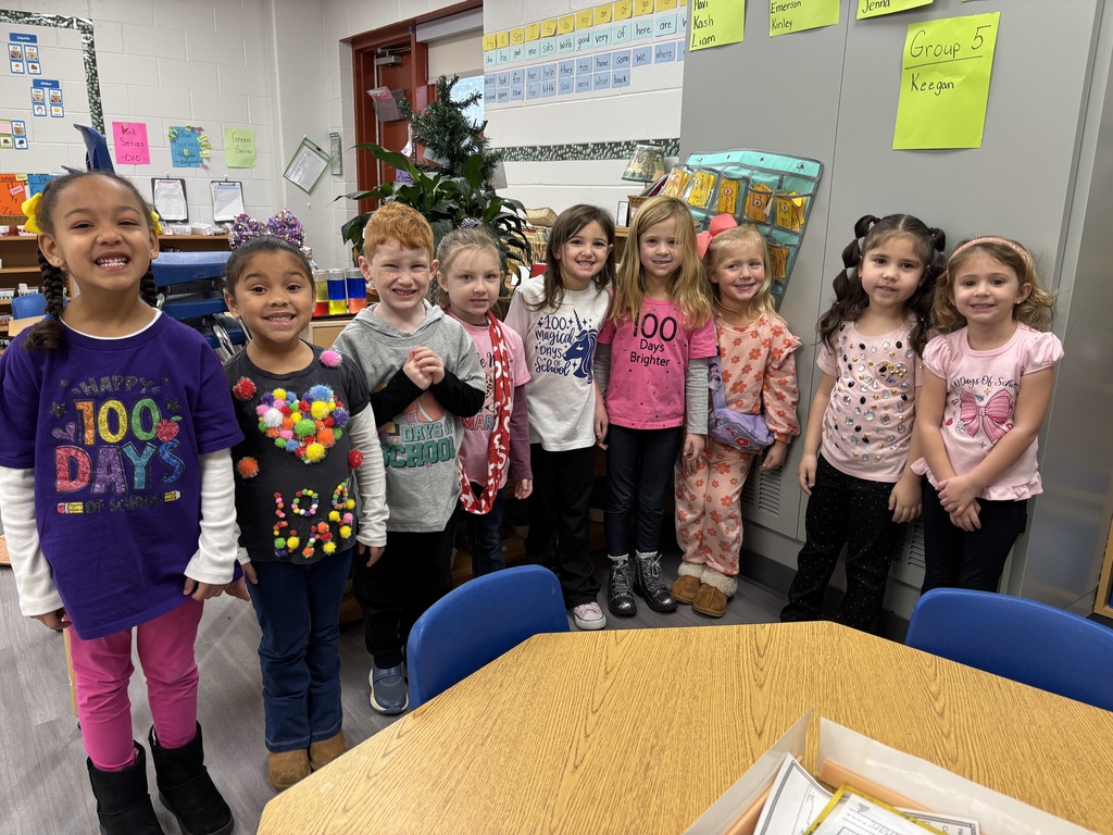 Students smiling on the 100th day of school
