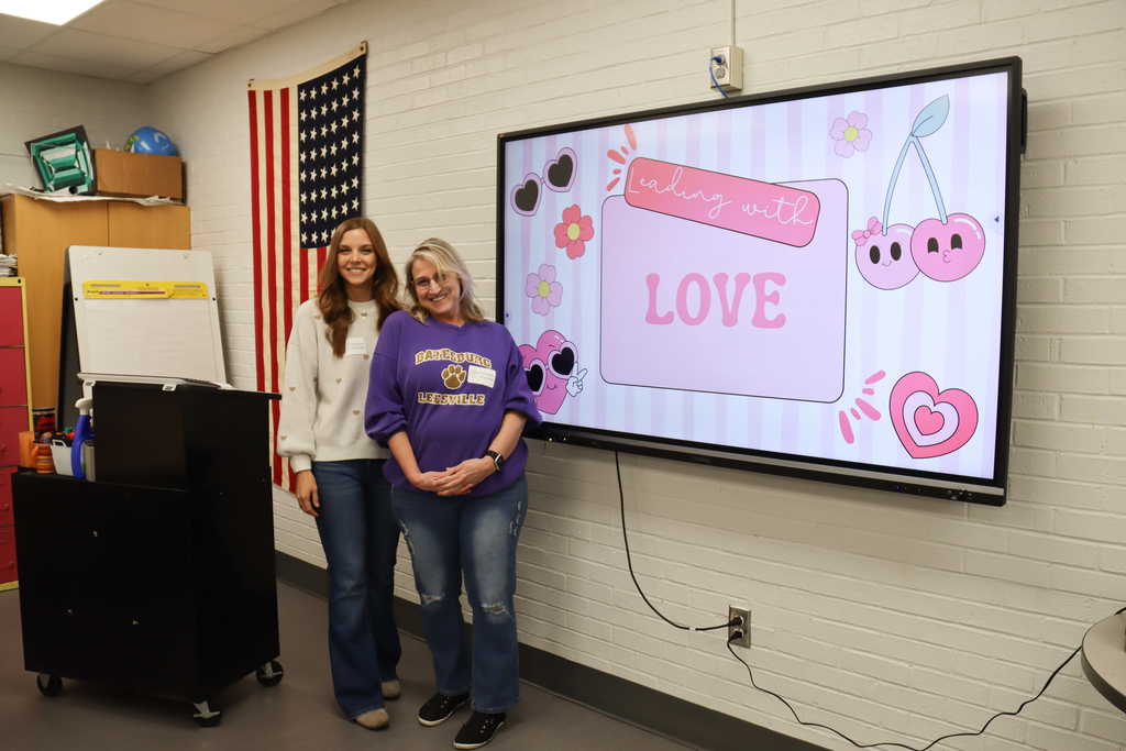 Love and leadership conference pic of smiling presenters