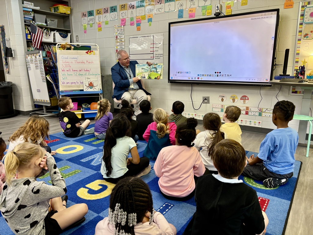 Dr. Atkinson reading to students