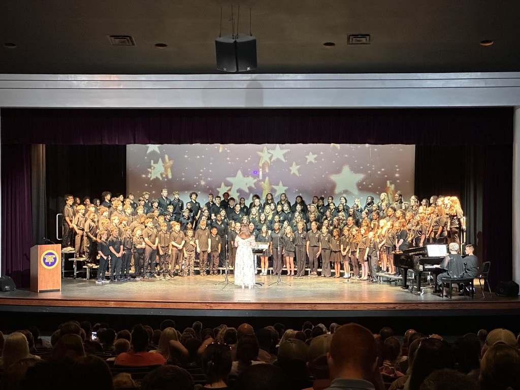 BLMS spring chorus singing on the stage