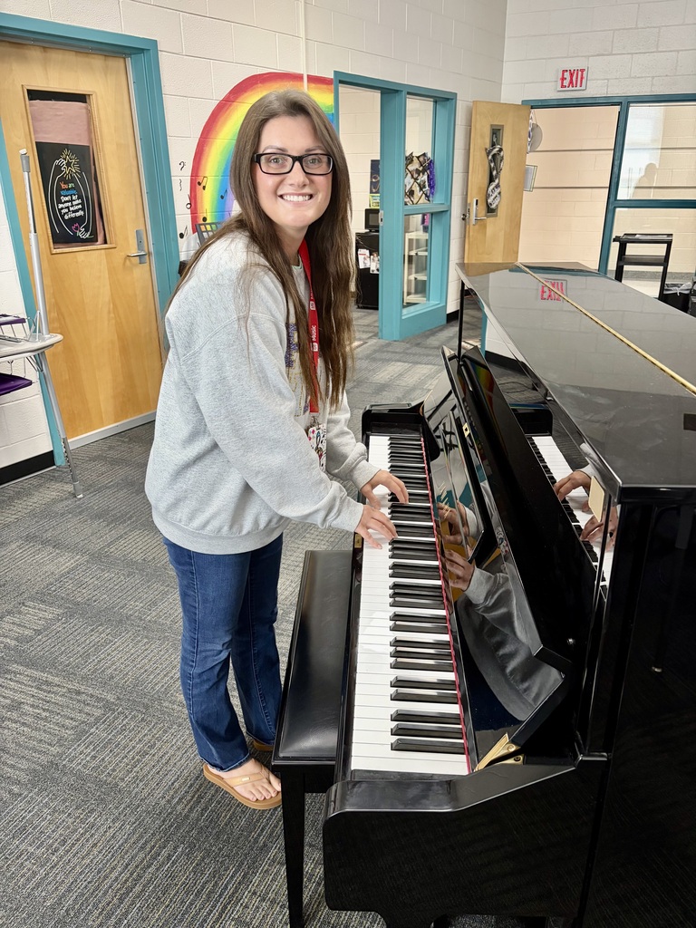 Picture of teacher playing piano