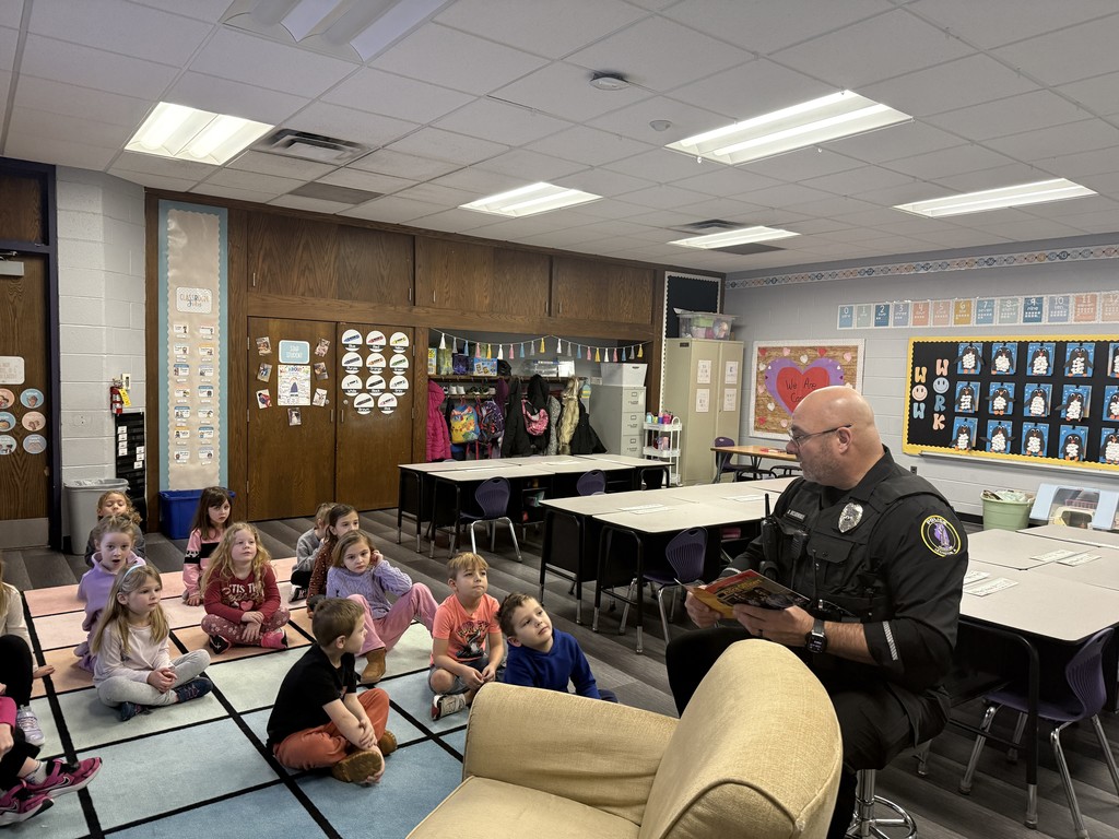 officer reading to kids