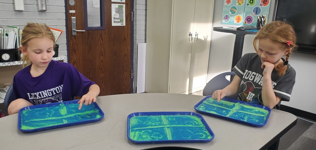 girls with sand trays