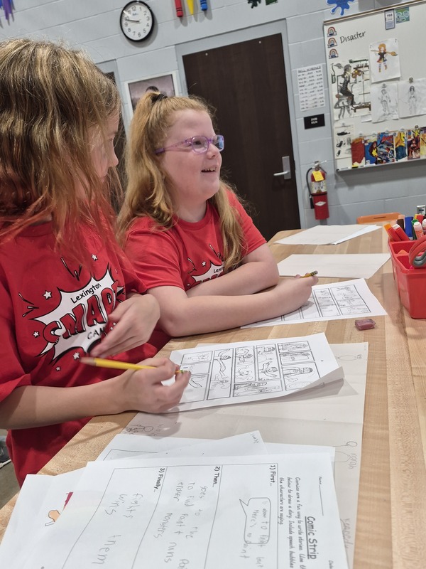 Students writing at table