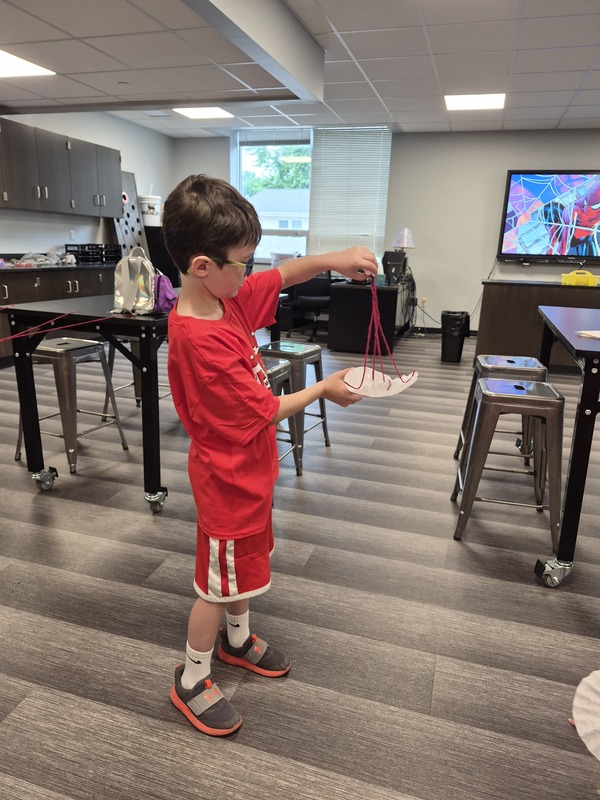 Student holding project