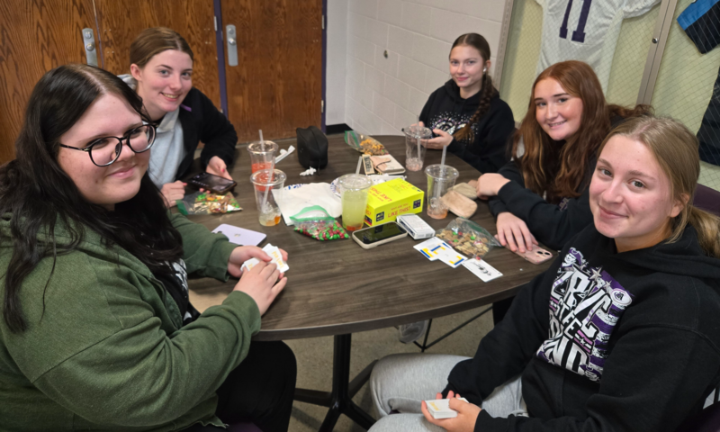 students sitting at a tale