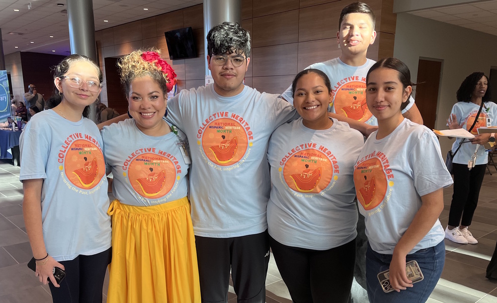Student interpreters pose with Paola Adams (2nd from left)