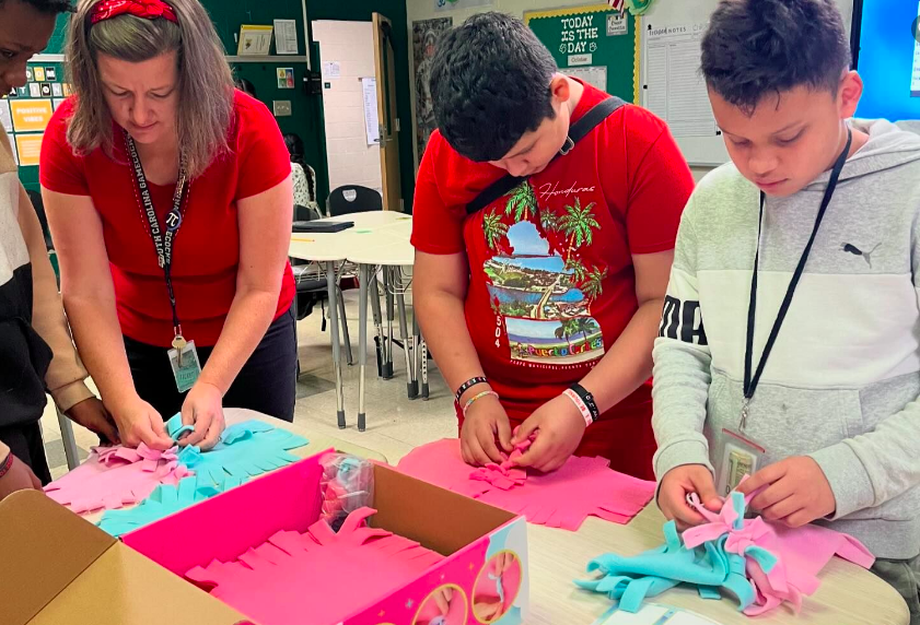 Working on multi-colored blankets for pets
