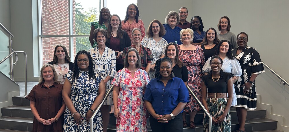 A group of Lexington Two's Teachers and Support Staff of the Year on the steps at the Performing Arts Center