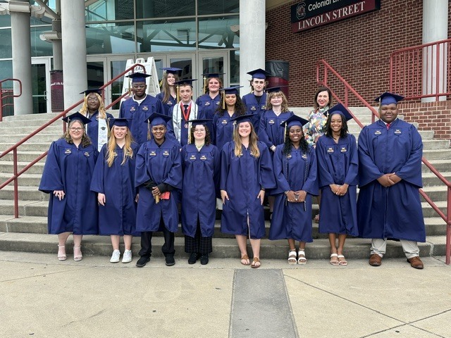 50 Lexington Two students pose on steps before Midlands Tech graduation in early May