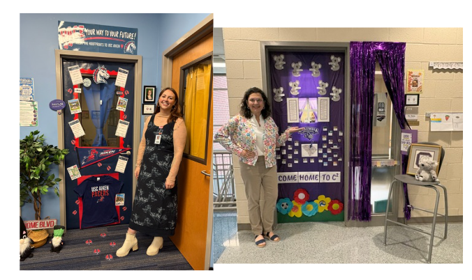 The two winners of the Gear Up college door decoration are shown smiling at the camera while standing at their decorated doors.