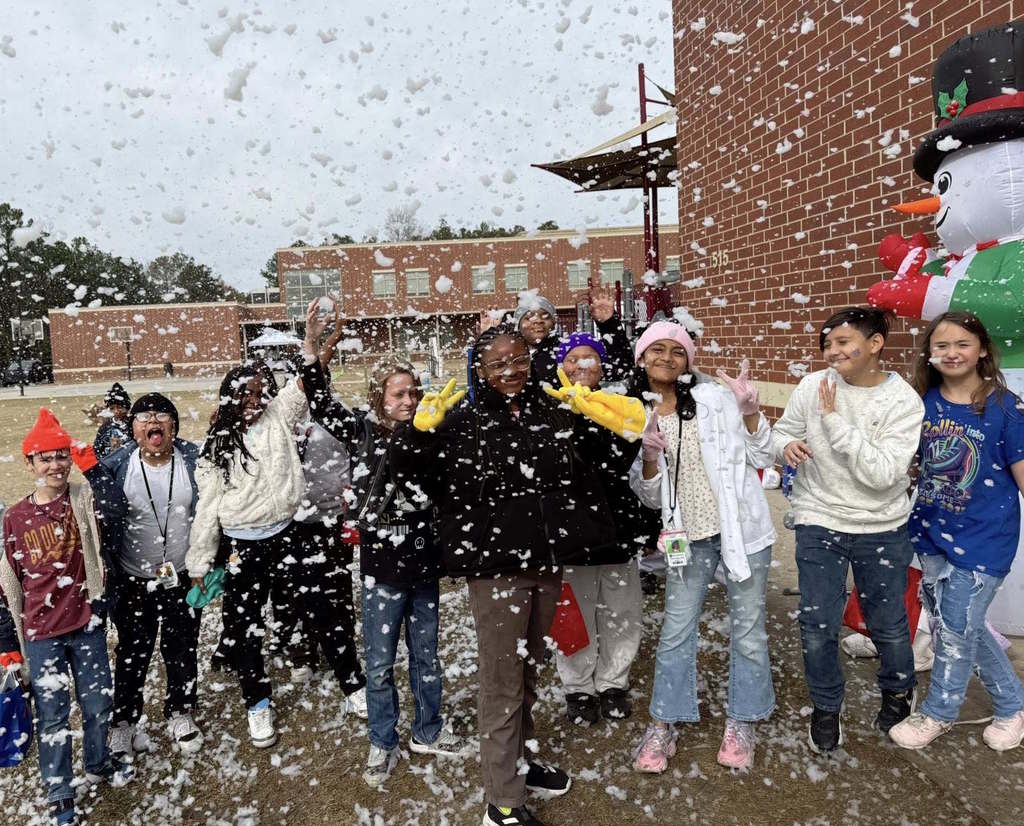 Cayce students play in the "snowfall" on the playground