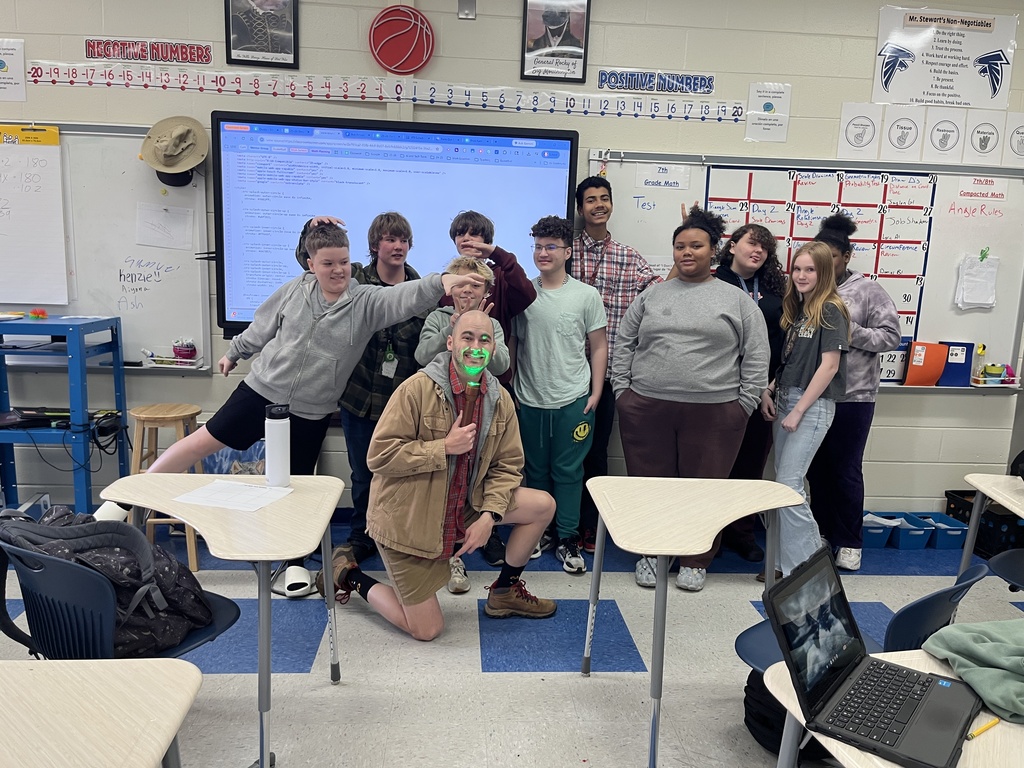 Mr. Stewart and students in his math class posing for the camera on the Camp-Read-A-Lot Day.