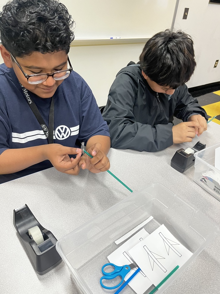 More students build their paper straw rockets.