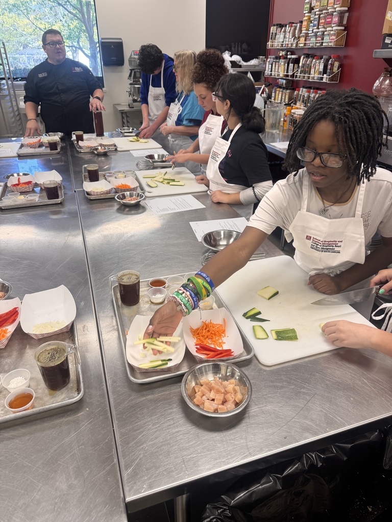 Students cutting zuchini into slices.