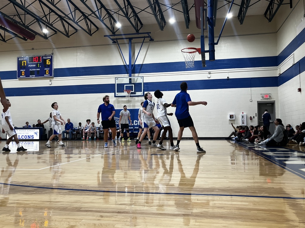 Boys look up at the ball to see it above the basket and to determine if it will go in the basket.