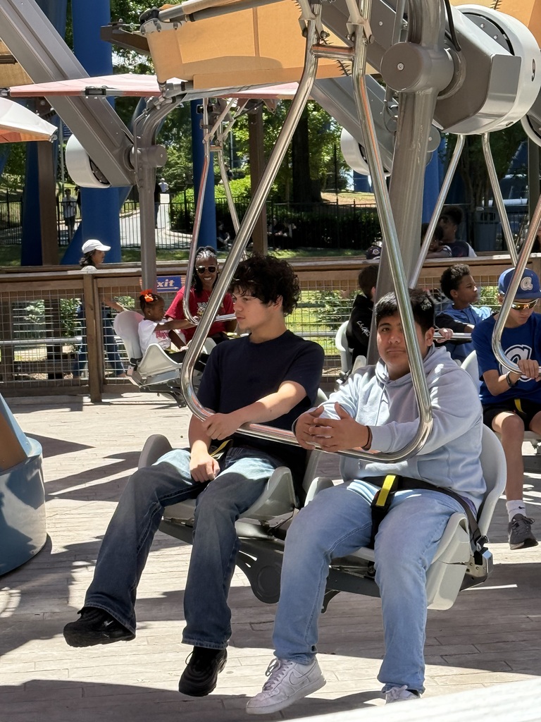 Students sit on the swings ride at Carowinds.